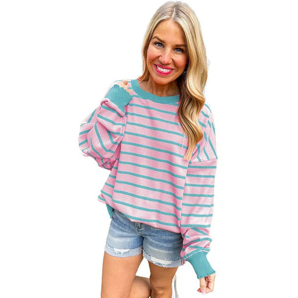 Selma | Orange striped loose sweater with a crew neck and shoulders - Image 9